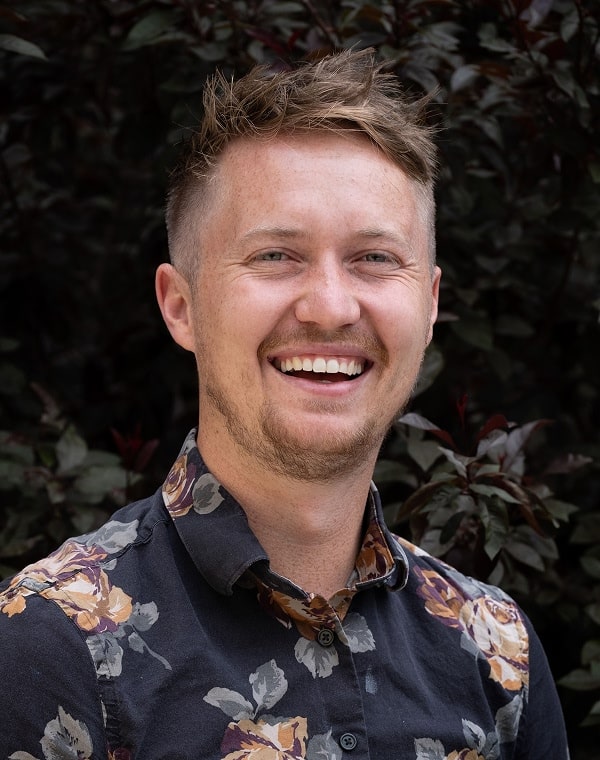 Colton Pond, CMO of LoanPro in a floral shirt